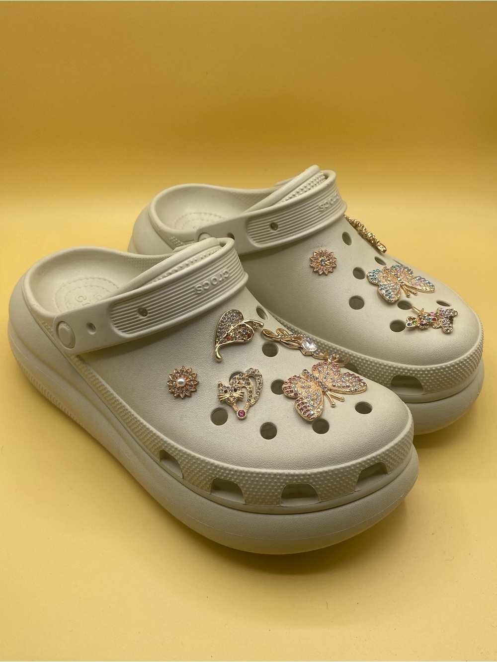 CROCS Cream Platform Clogs with Gold Butterfly Charms​